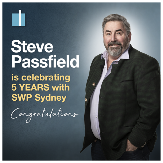 Steve Passfield celebrates 5 years with SWP Sydney, standing in a suit jacket with congratulatory text