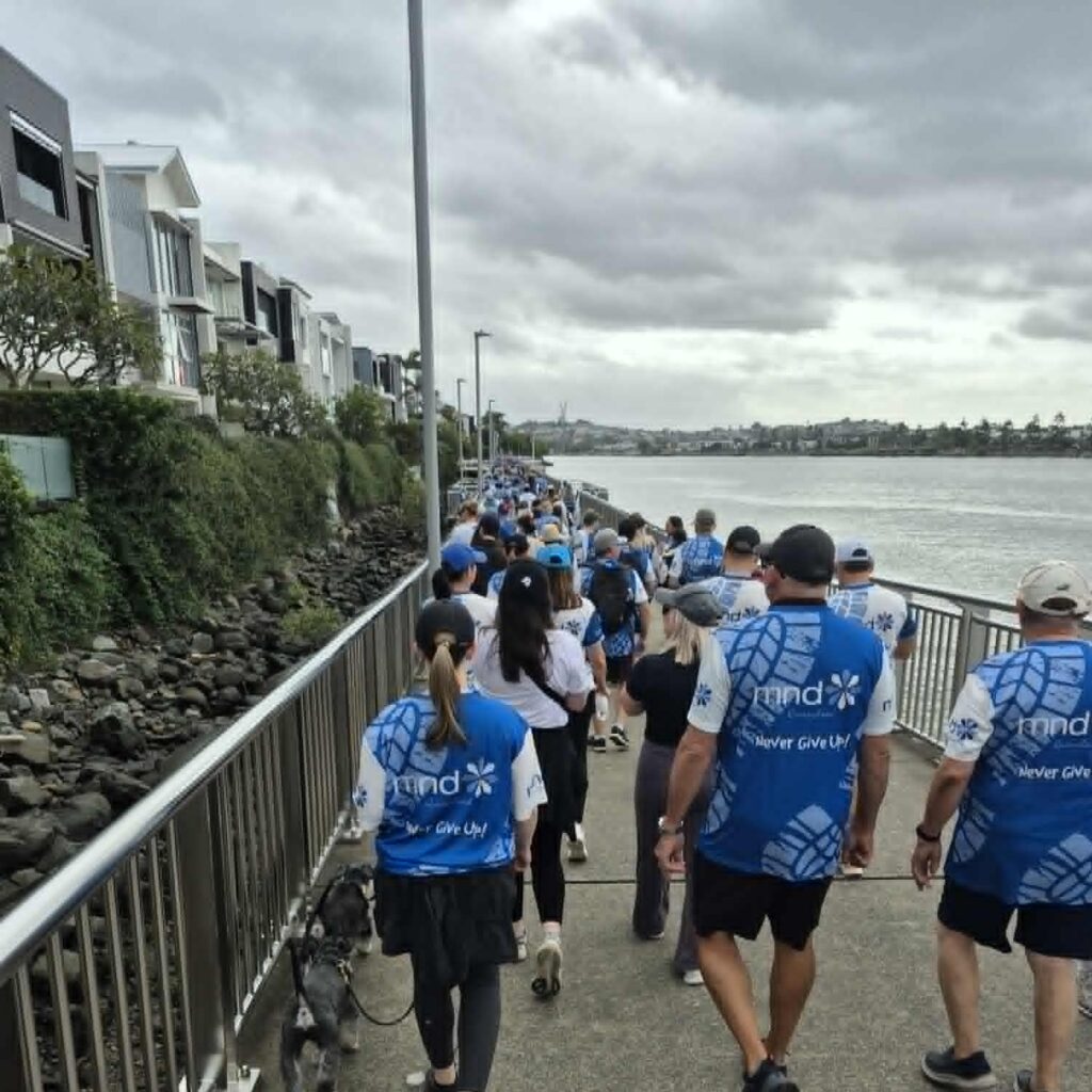 Participants take part in the Walk to Defeat MND walk along Brisbane river